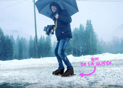 Herve patine avec sa caméra et son parapluie en suisse